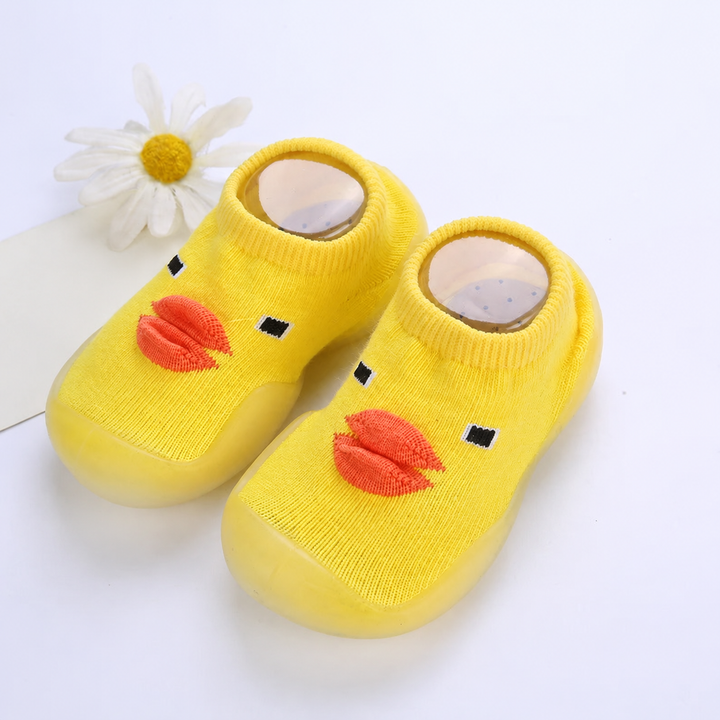 Yellow duck-face sock shoes with orange beaks and matching soles