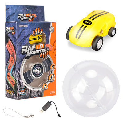 Yellow stunt toy car with a clear ball, USB cable and retail box