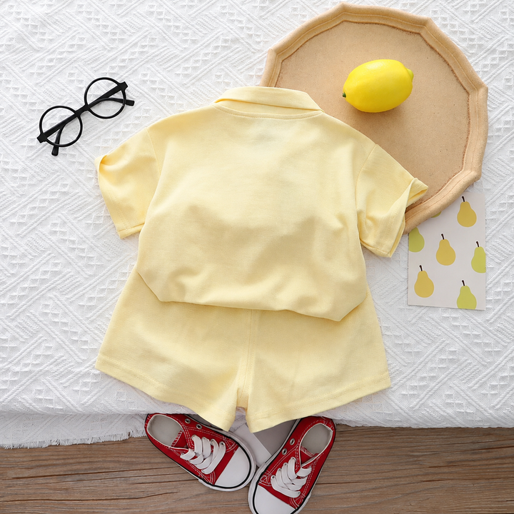 Back view of the yellow short-sleeve top and matching shorts
