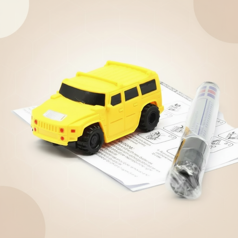 Yellow toy car with a drawing pen and instruction sheet