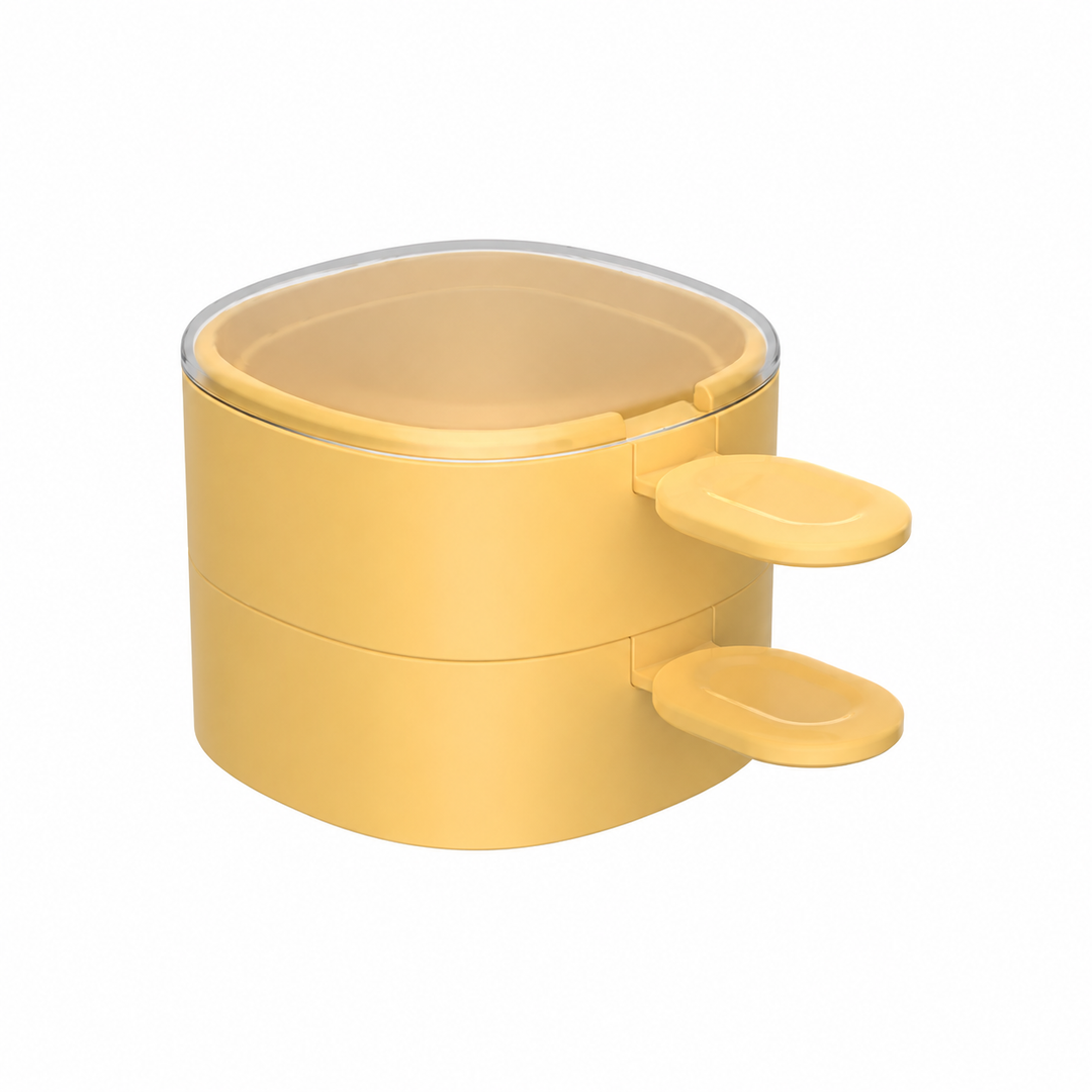 Two yellow ice cream molds stacked with matching spoons and a clear lid on top.